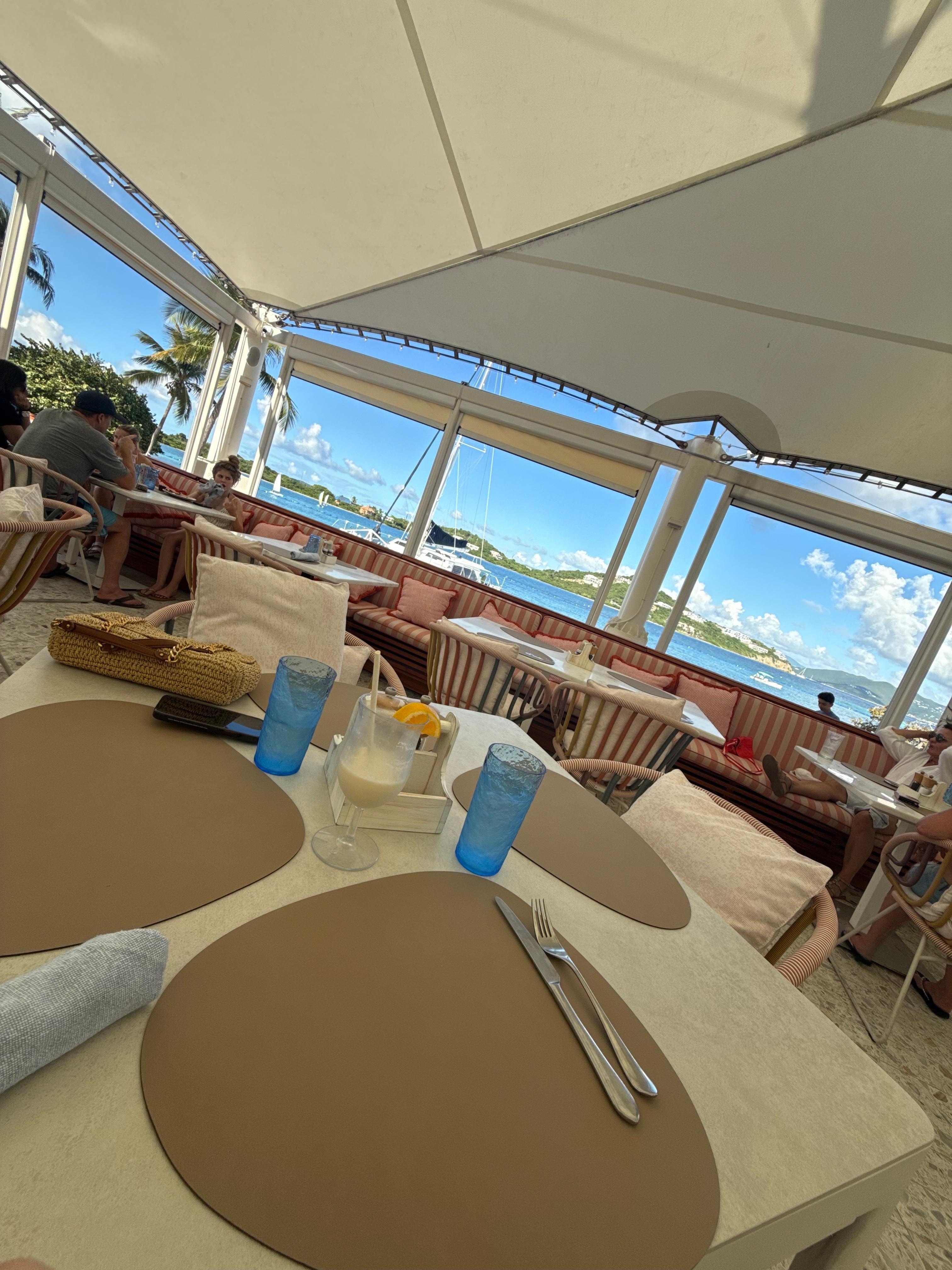 Sitting at Sails restaurant by the pool/beach