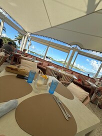 Sitting at Sails restaurant by the pool/beach