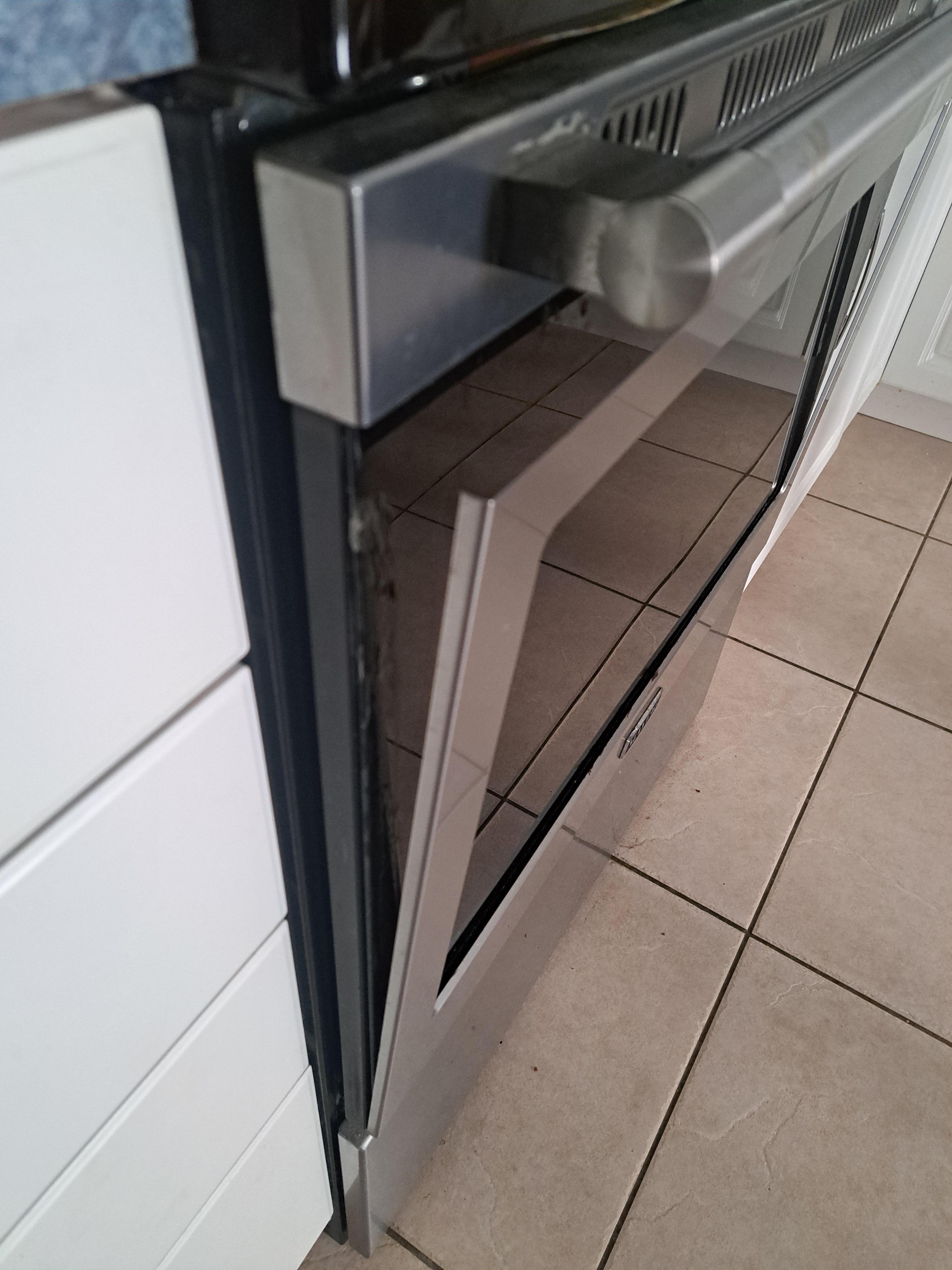 Front panel of stove coming apart. Can see glue, so bad repair.