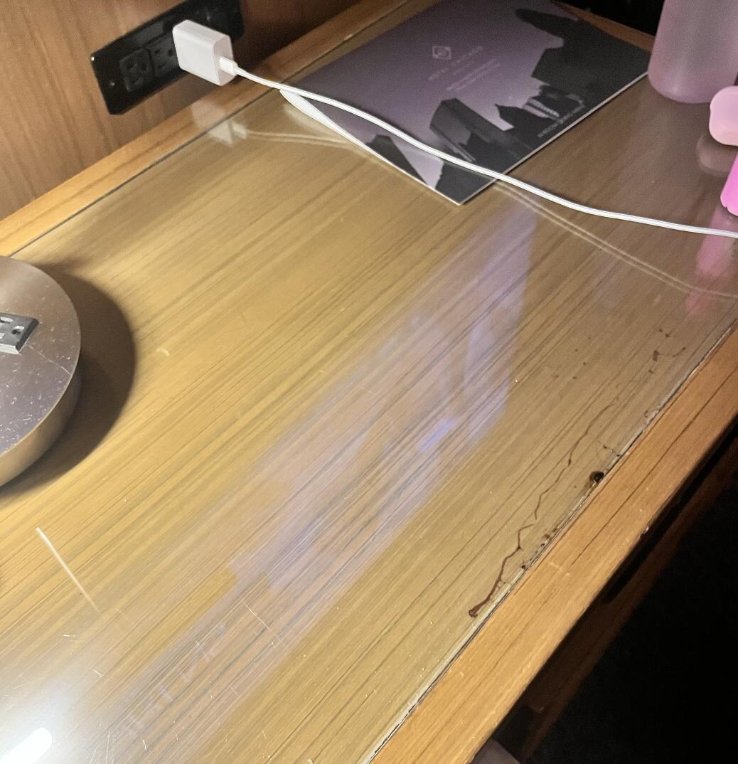 Old wine marks under the glass of the table