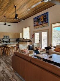 Spacious kitchen and comfy couches and chairs