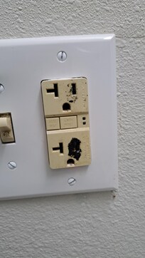 Plug in the bathroom, looks like something was melted into it