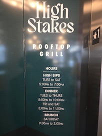 Permanently affixed sign near main elevator