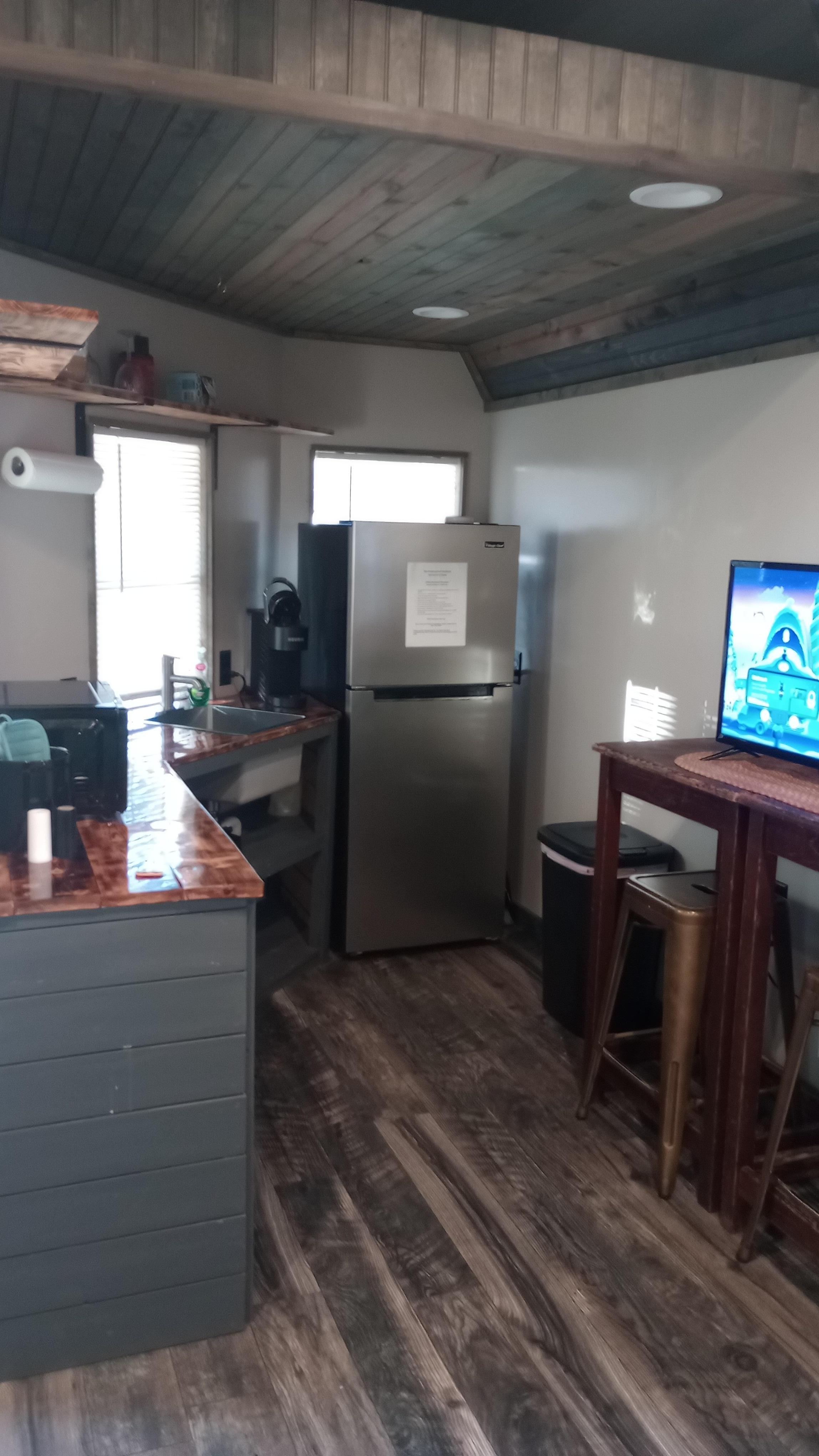 Front kitchen - frig, sink, microwave, coffee maker, griddle for cooking. 