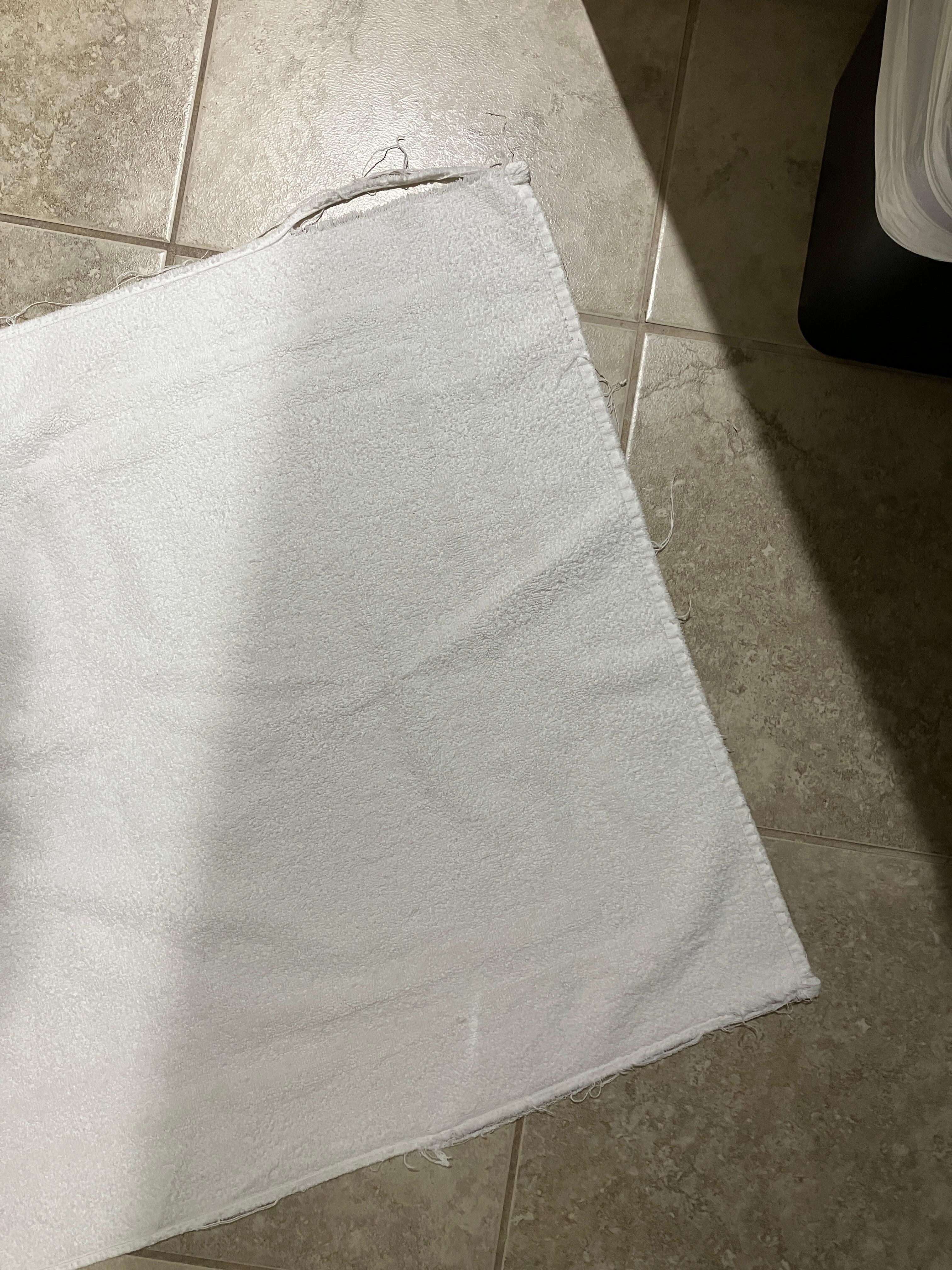 Fraying bath mat.