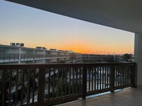 View from the front door of the unit looking over the pools.