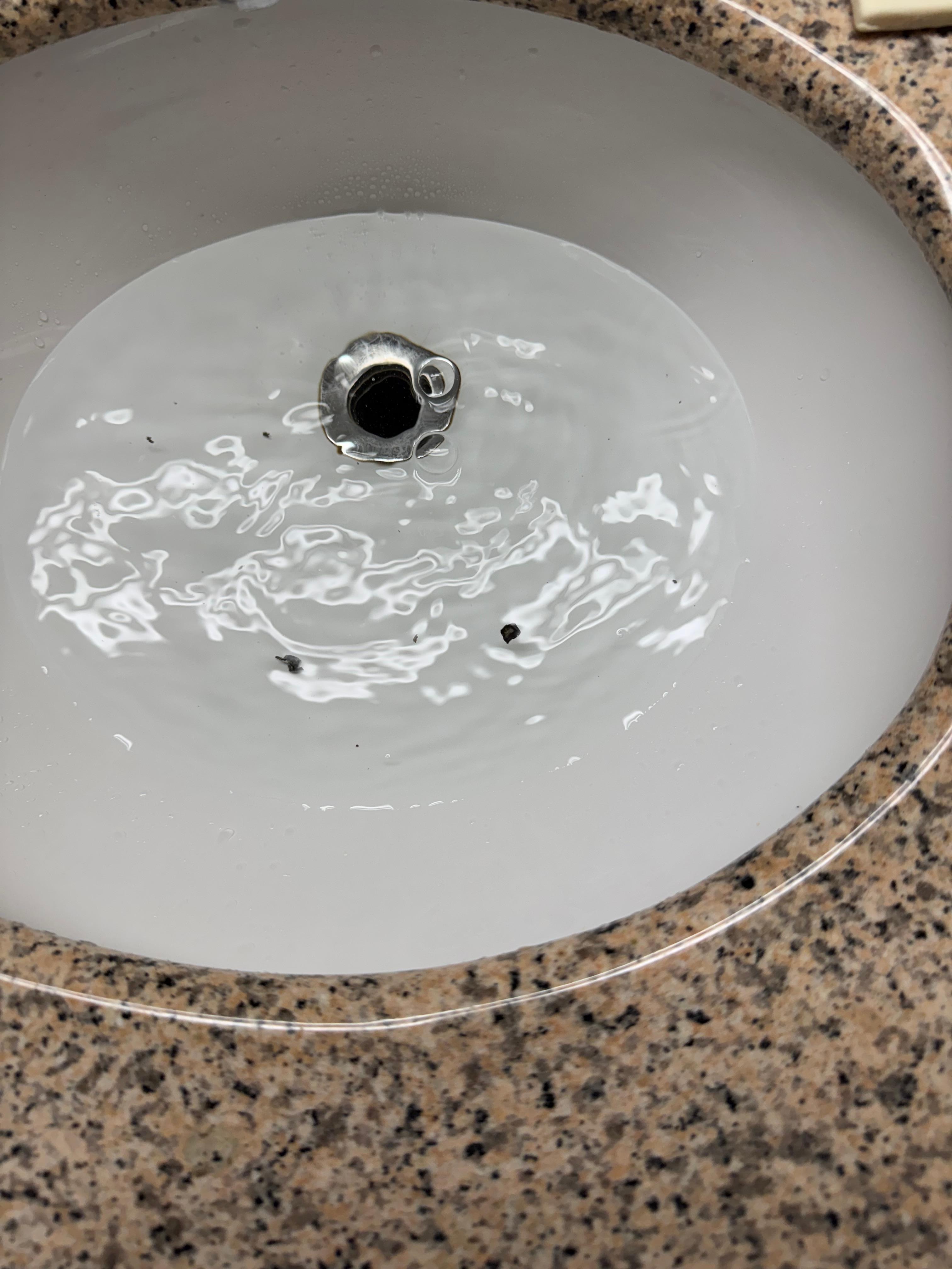 Sink stuffed up black stuff coming up