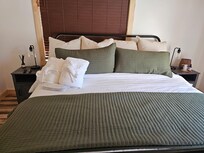 The large, comfortable bed in the bedroom is everything you need for quality sleep and rest.