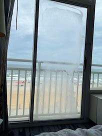 Blotchy glass door obstructing the ocean view which we have paid for in choosing oceanfront room.