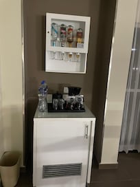 the fridge and bar in room FREE DRINKS + water daily