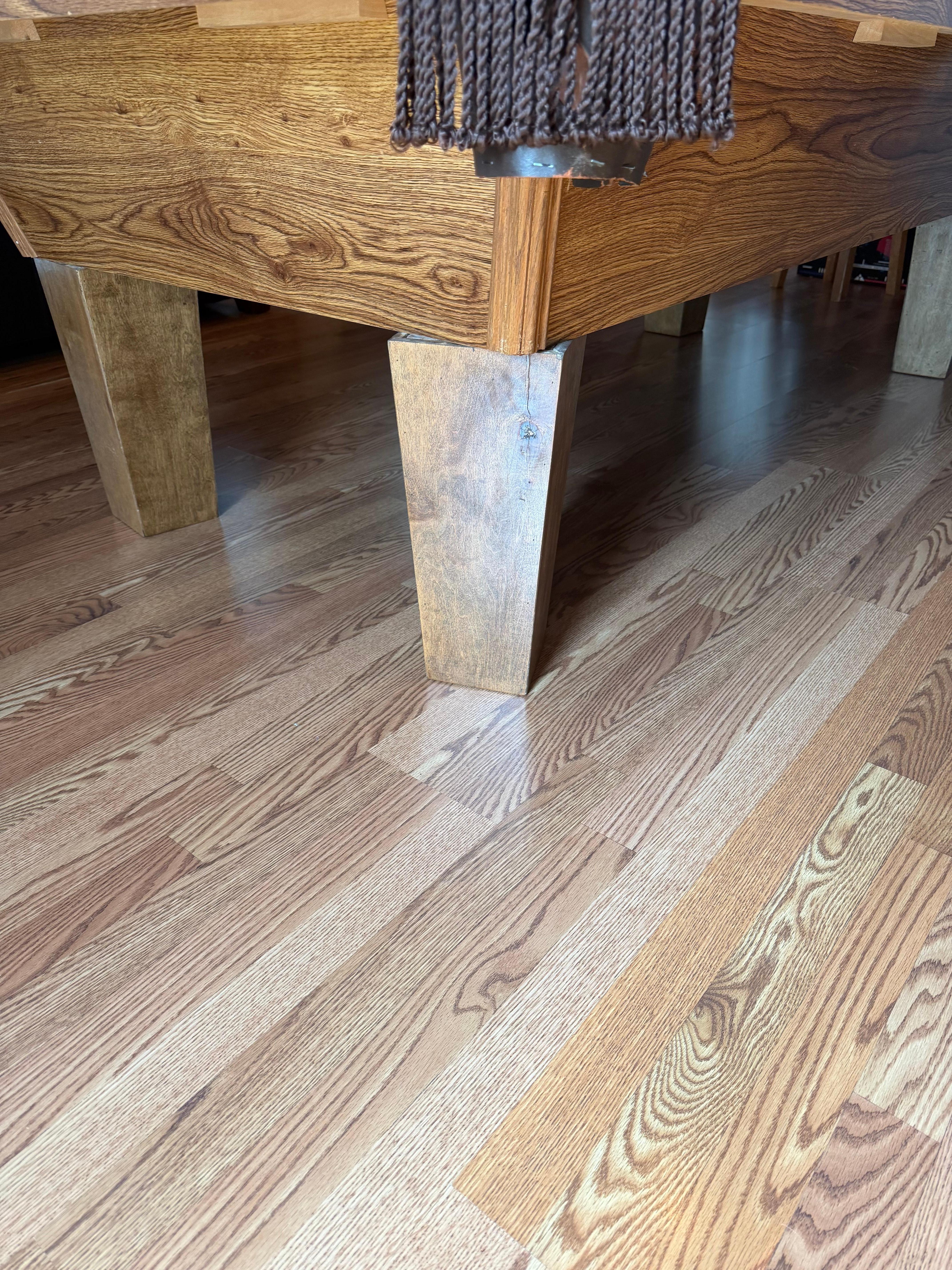 Pool table next to pull out couch that can’t simply be pushed over. 