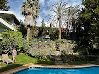 View of the pool area and back of the property.