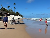 praia, distante 330 m