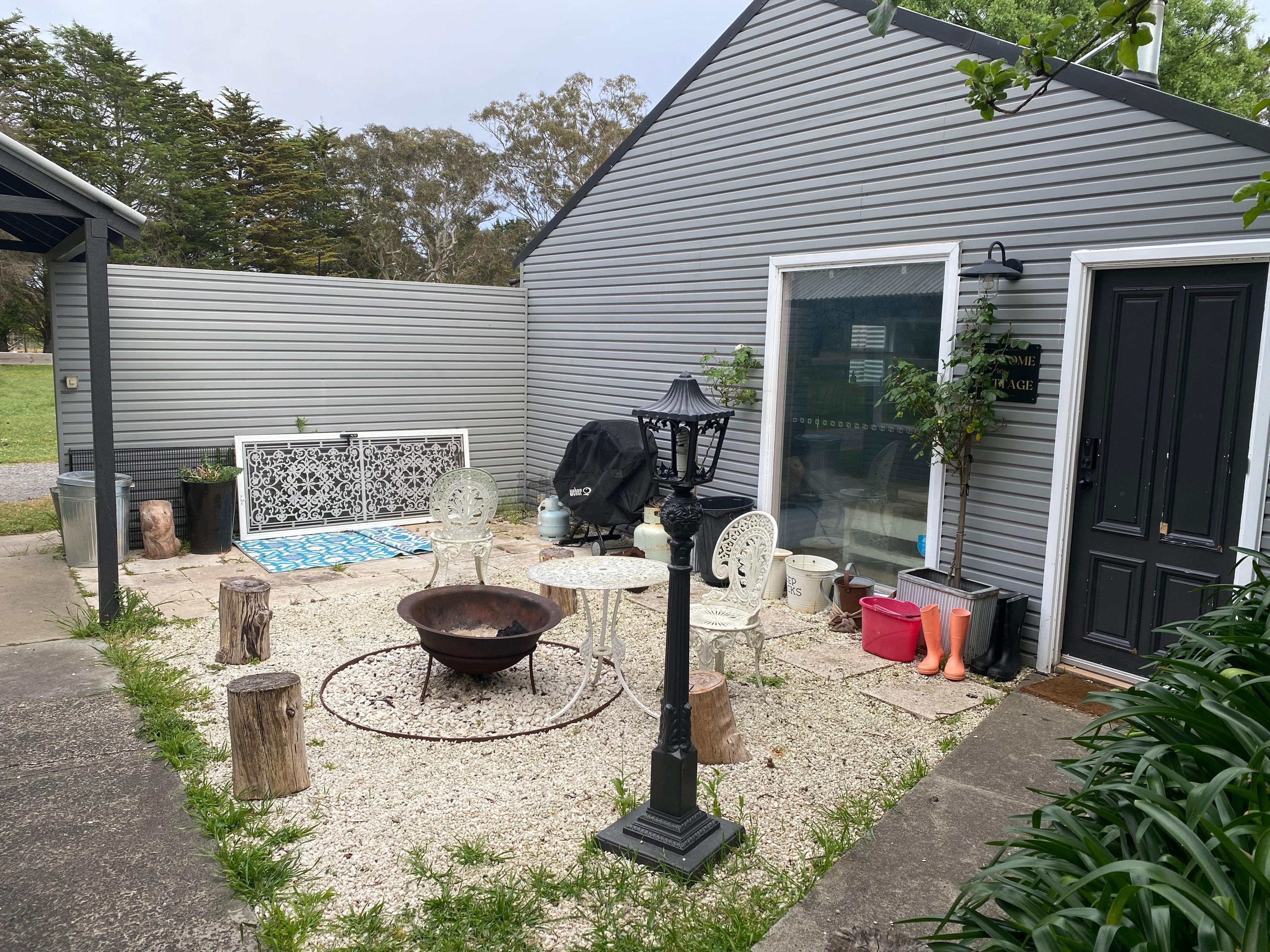 Nothing comfortable about this. Those awful wrought iron chairs are horrible to sit on