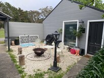 Nothing comfortable about this. Those awful wrought iron chairs are horrible to sit on