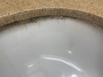 The sink had mold around it. The glue from fixing the sink was loose.