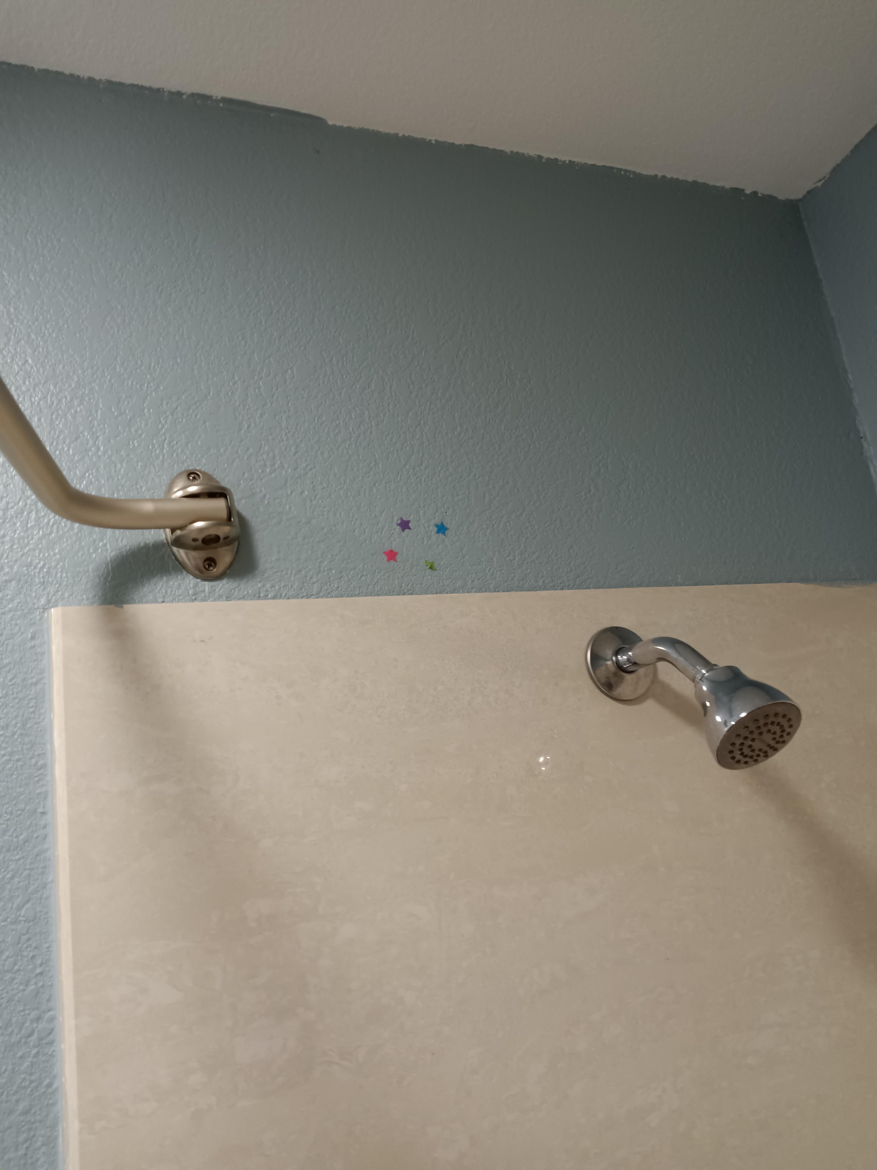 Acne stickers left on wall in shower 