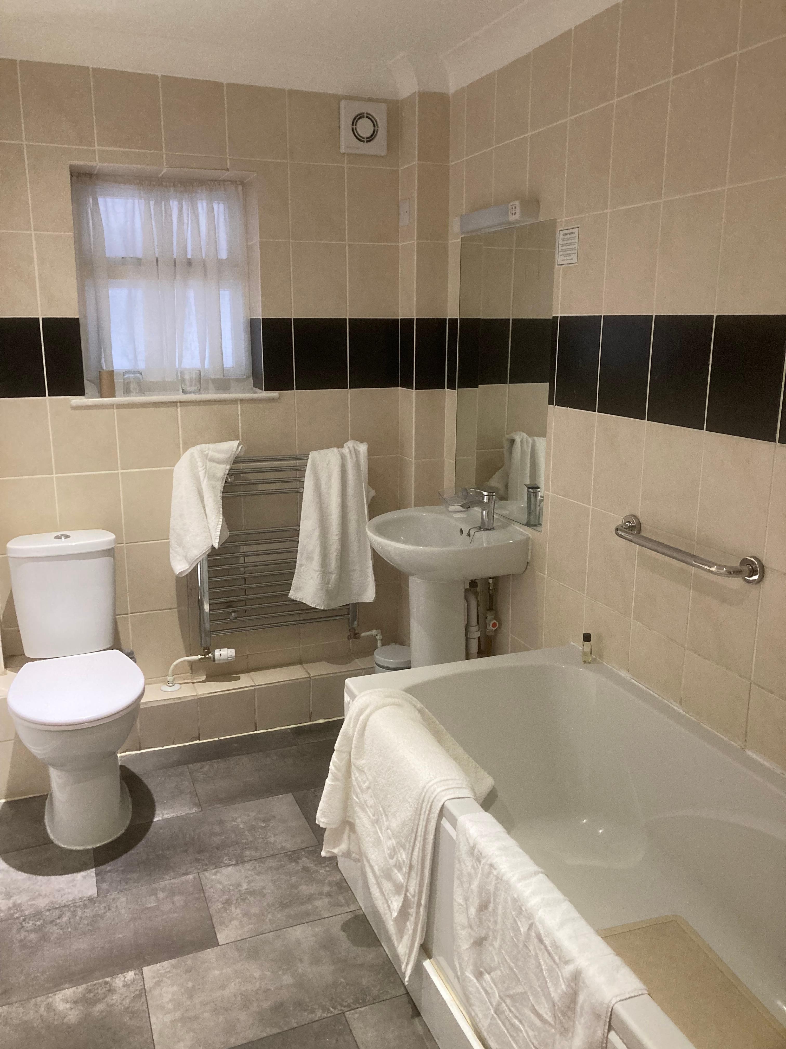 The bathroom was clean but in need of refurbishment particularly on the bath panels and towel rack