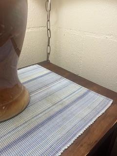 old, stained dirty mat on night stand