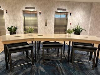 Tables and Chairs set up for a quick bite or Starbucks purchase.