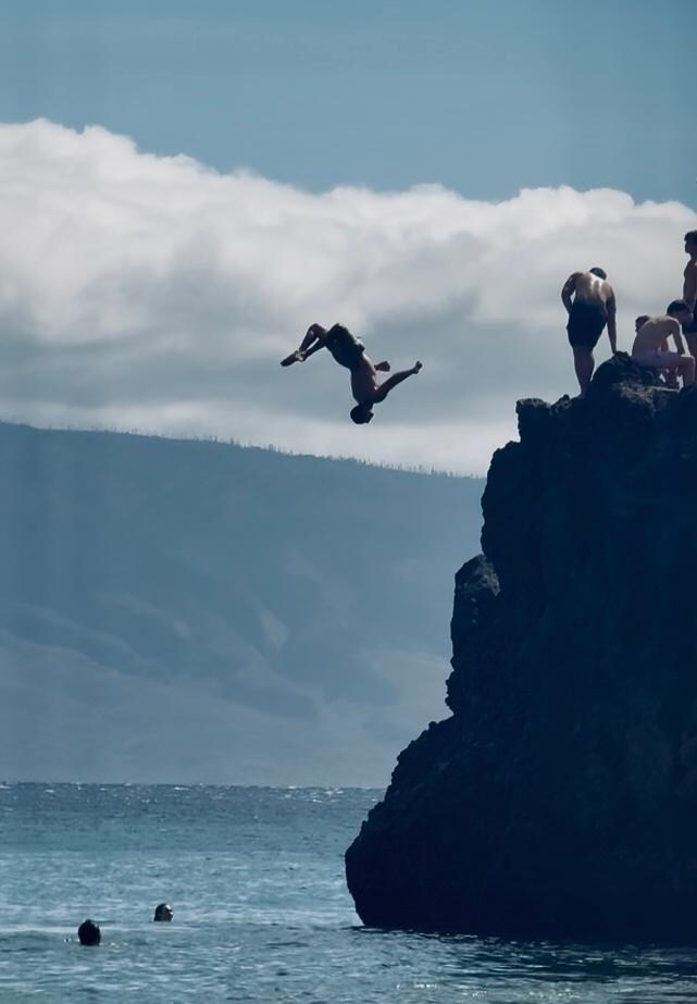 Cliff divers at Black Rock, about 1/4 mile down the beach from Outrigger…fun to watch.