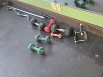 this is all the weights in the gym. mismatched. and grody.