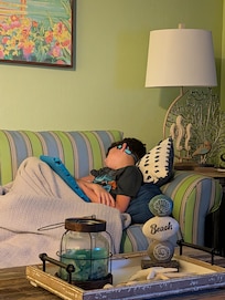 Passed out on the couch after a grueling day of swimming, beaching, and crab hunting!