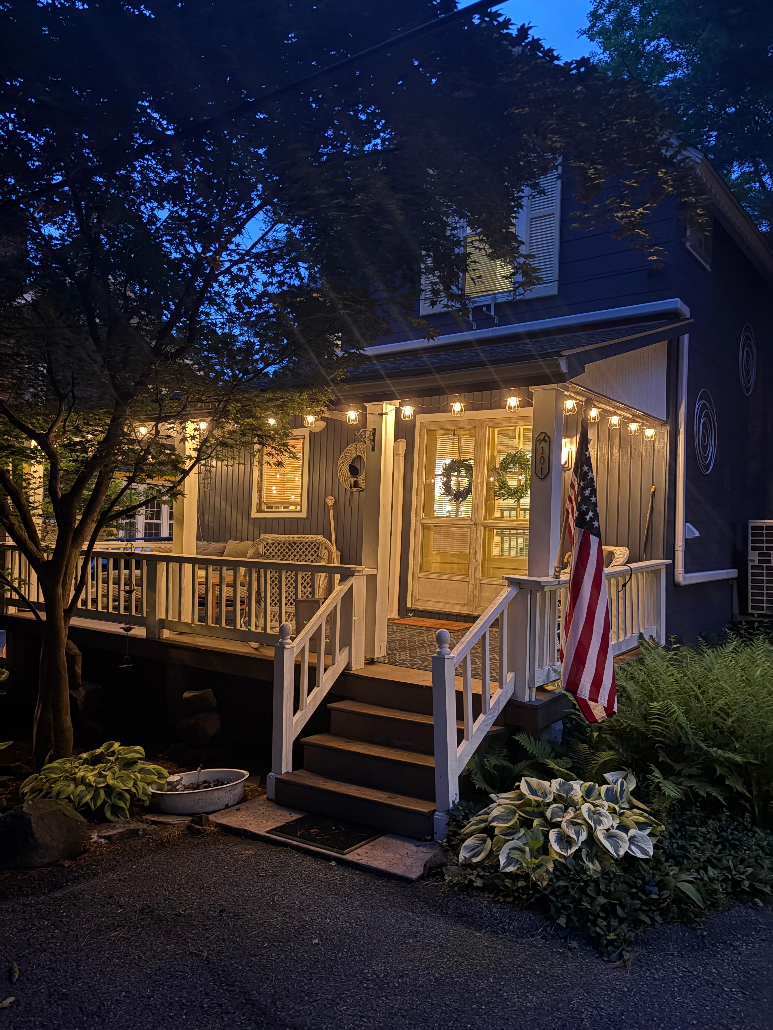 Home in the evening with the porch lights.  So welcoming!