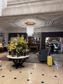 Inviting reception area with fresh cut flowers, flavored water, bellmen, doorman and borrowed umbrellas!