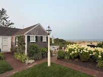 Front of the cottage showing bay to the right.