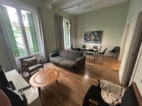 Curtains are coming off on right window.