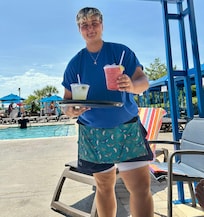 Our delightful server at the pool — very attentive service all day long,