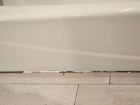 Mold and calk pealing around floog of tub in room