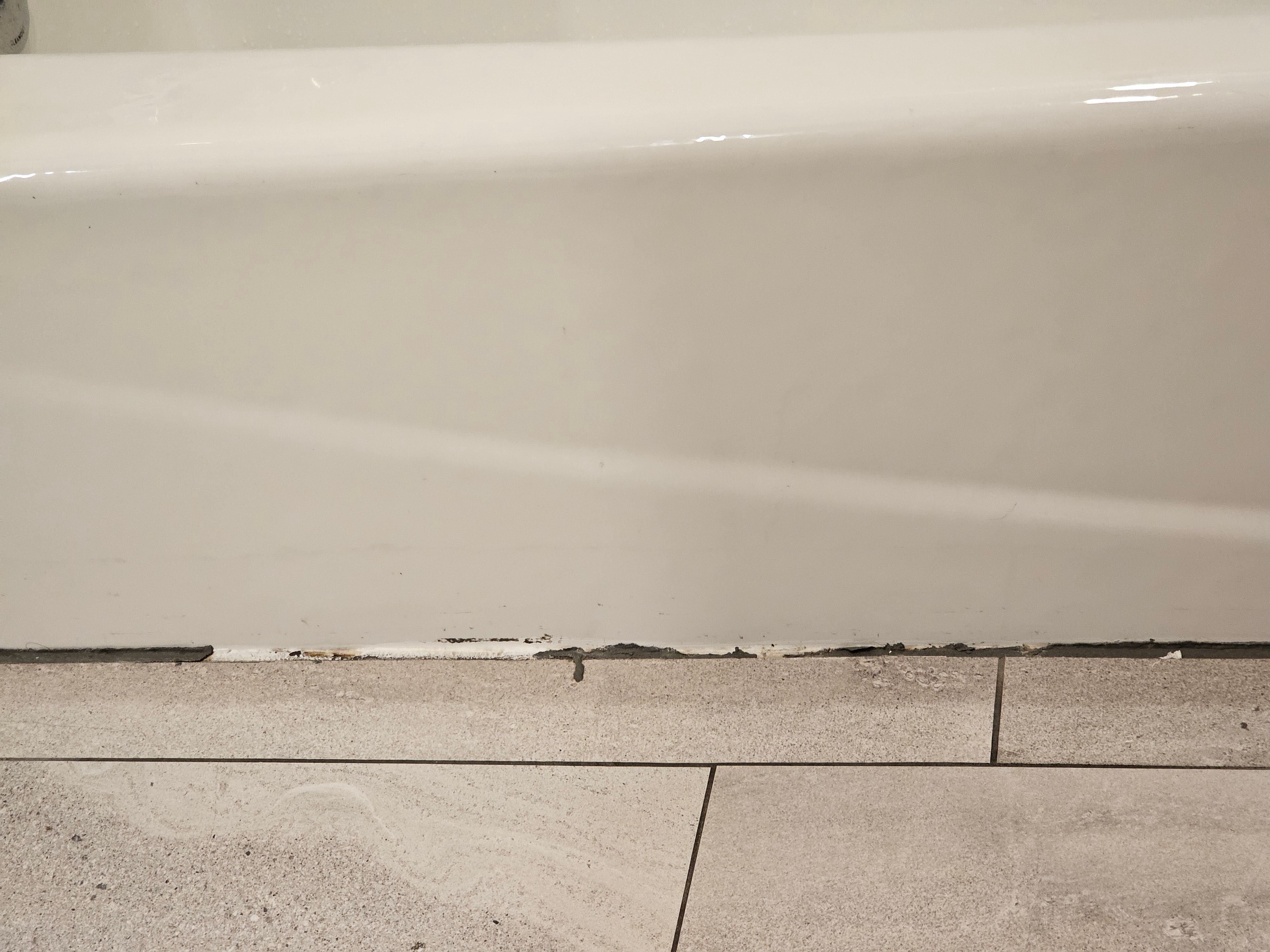 Mold and calk pealing around floog of tub in room