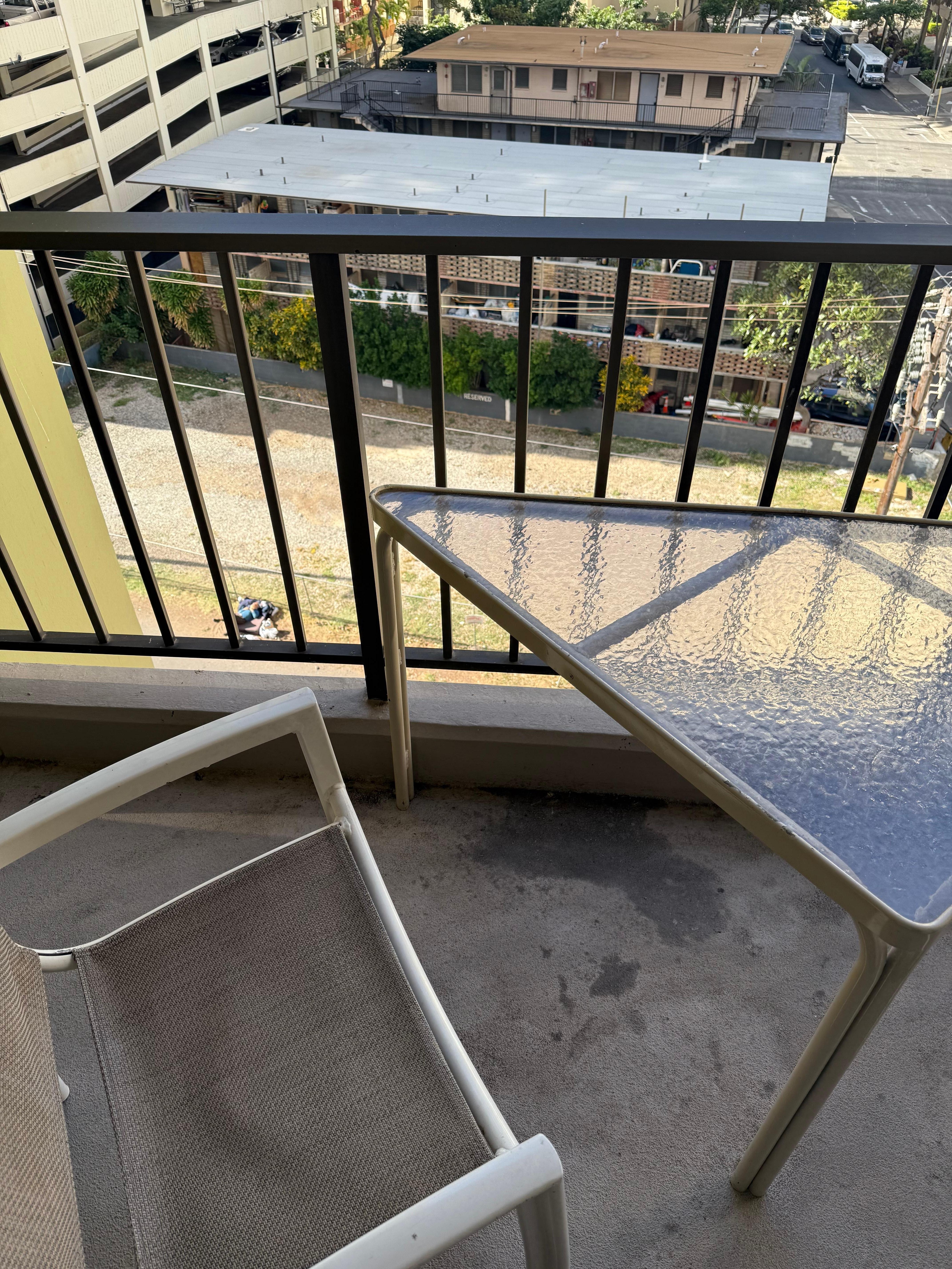 Our dirty deco with a view of a homeless off to the left. This photos was taken after we wiped down the table. 