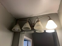one functioning bulb in bathroom