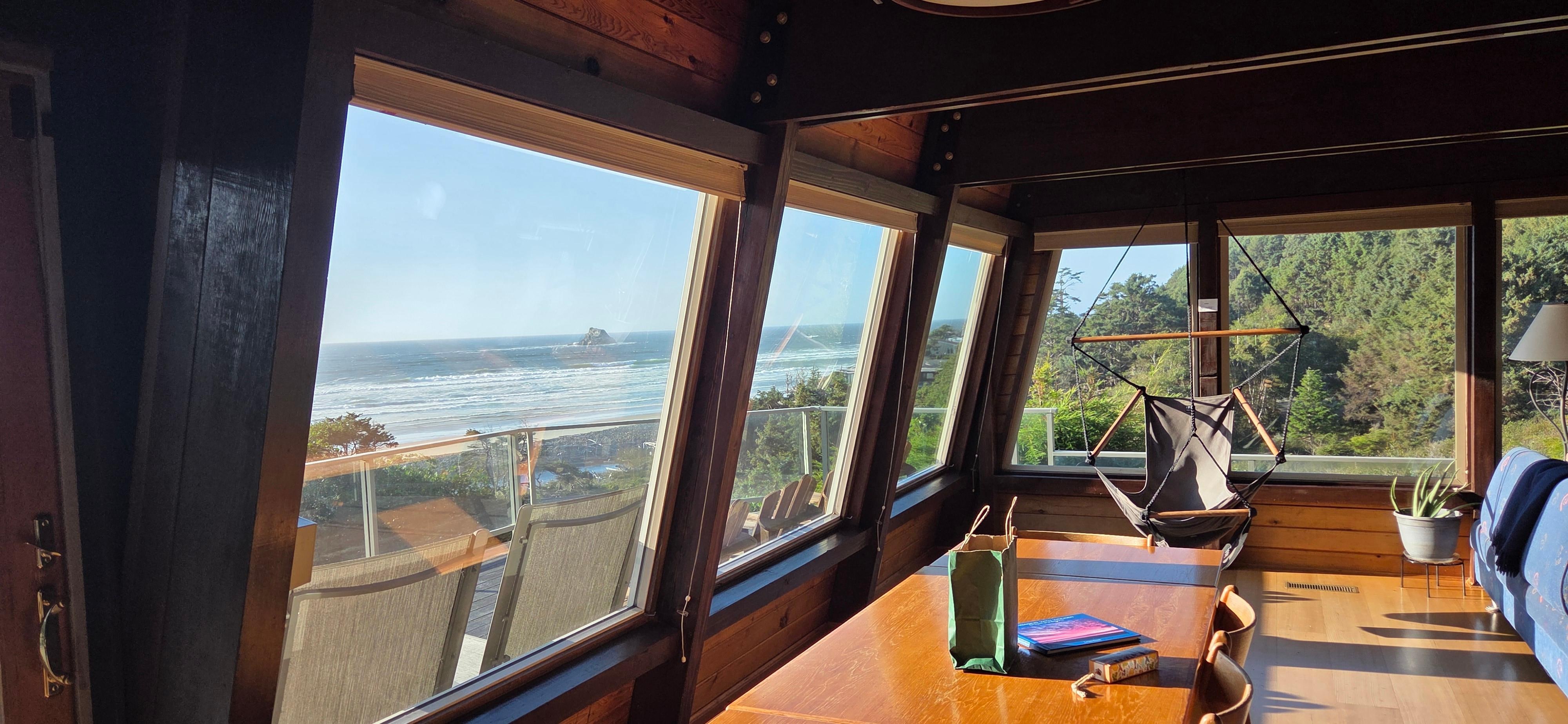 View from the kitchen looking toward the deck and the dining table.