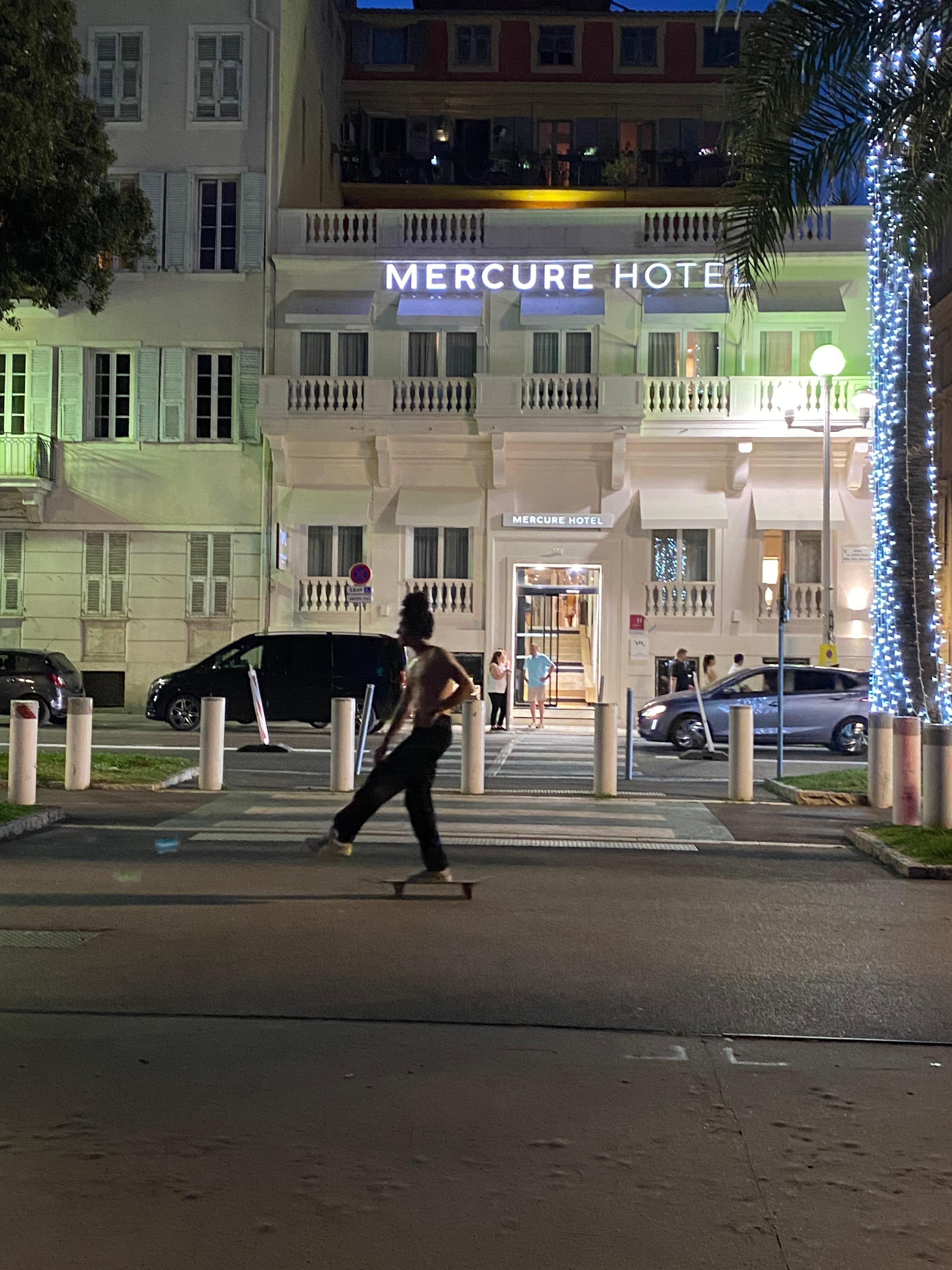 The hote's front entrance at night.