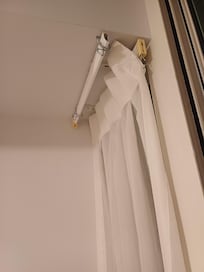 missing curtain in main bedroom on side of sliding doors. sheer curtain was the only curtain here