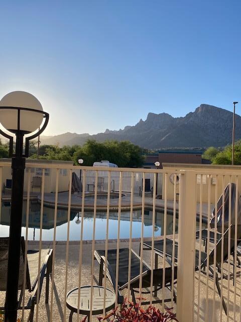Sunrise looking out at the Catalina Mountains over the pool