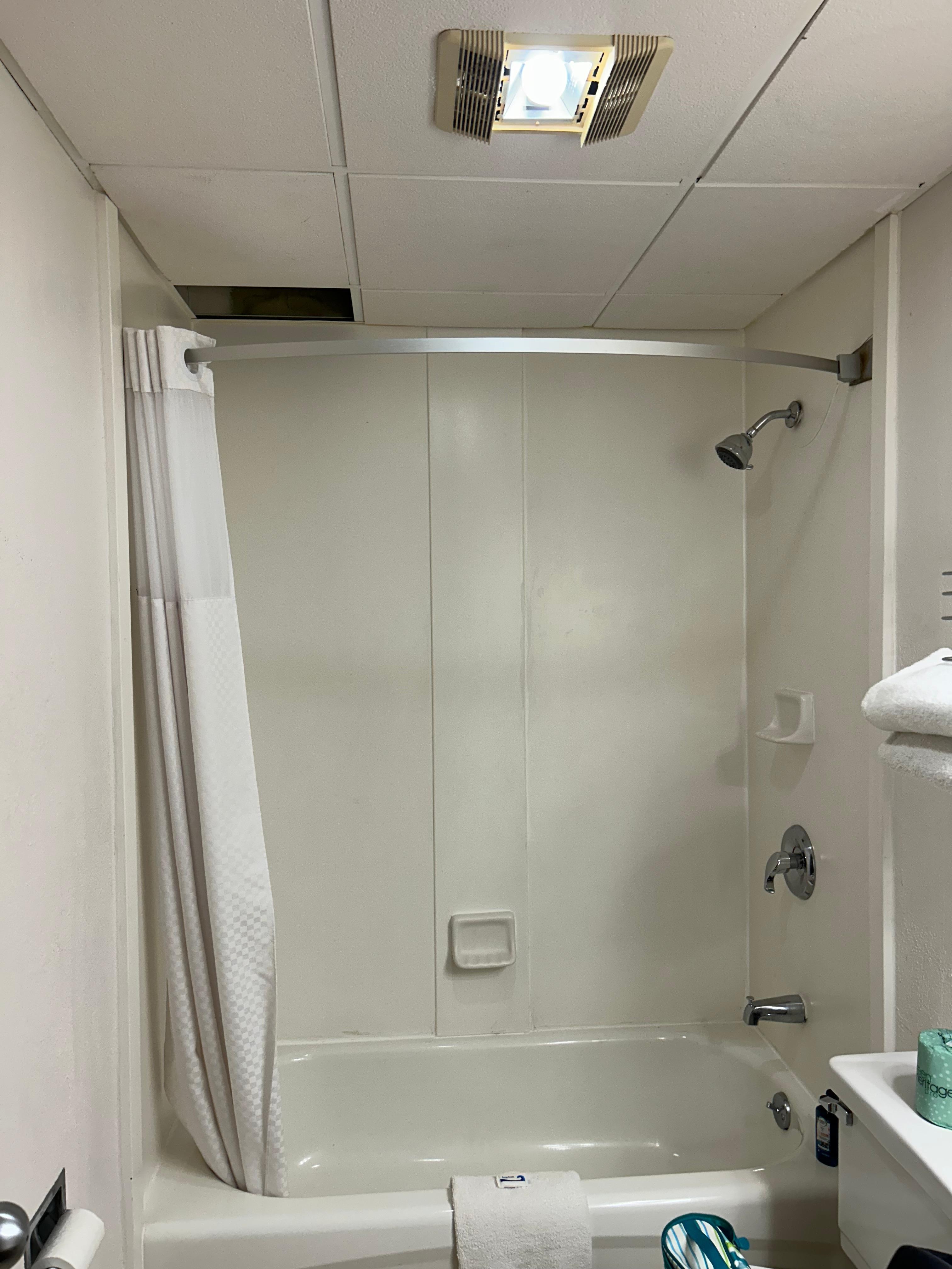 Hole in ceiling above the shower