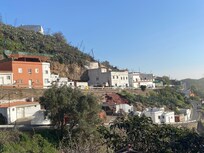 This apartment is one of two located in the building in the middle of this picture.