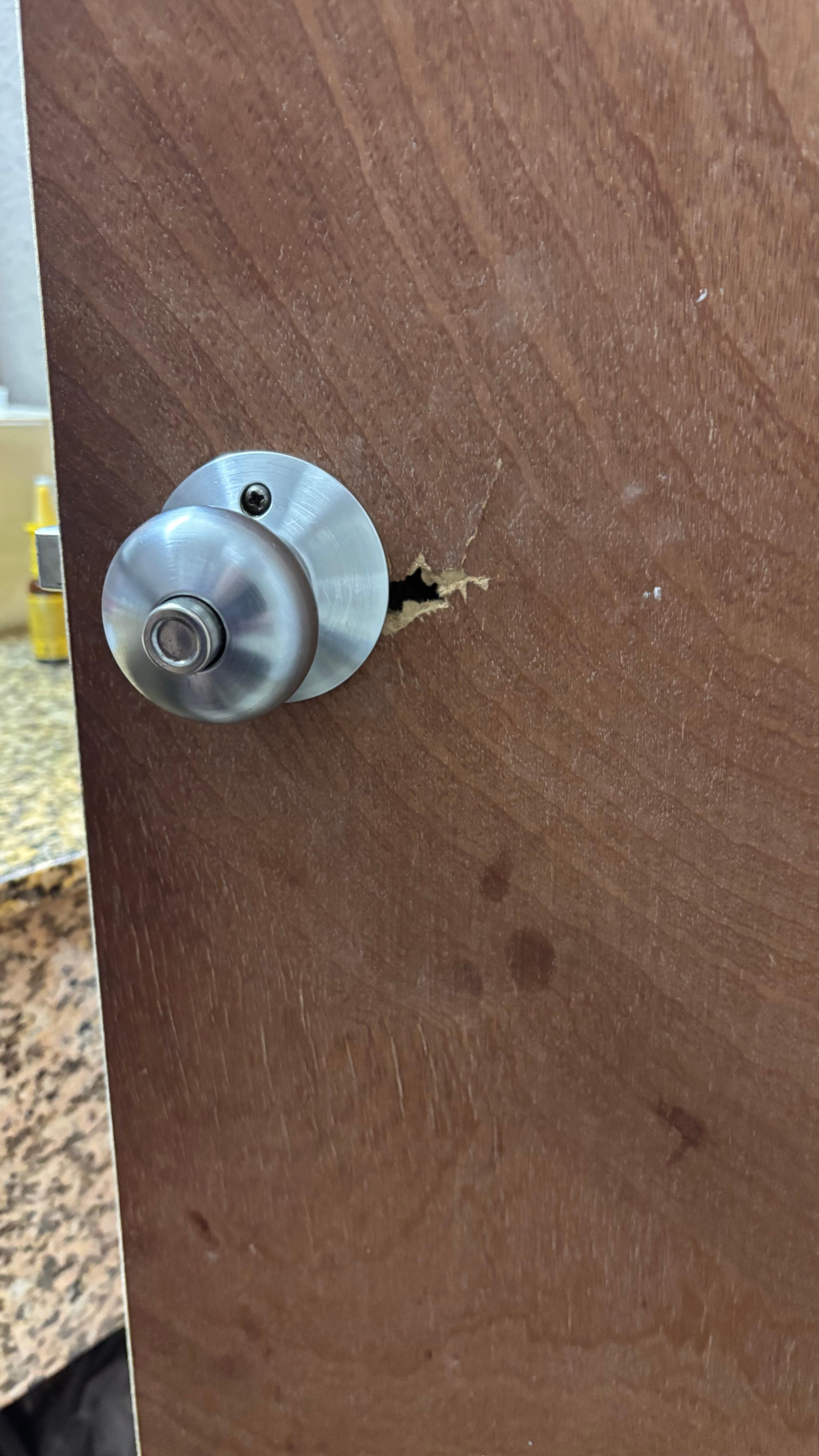 A hole by the Door knob in the bathroom 