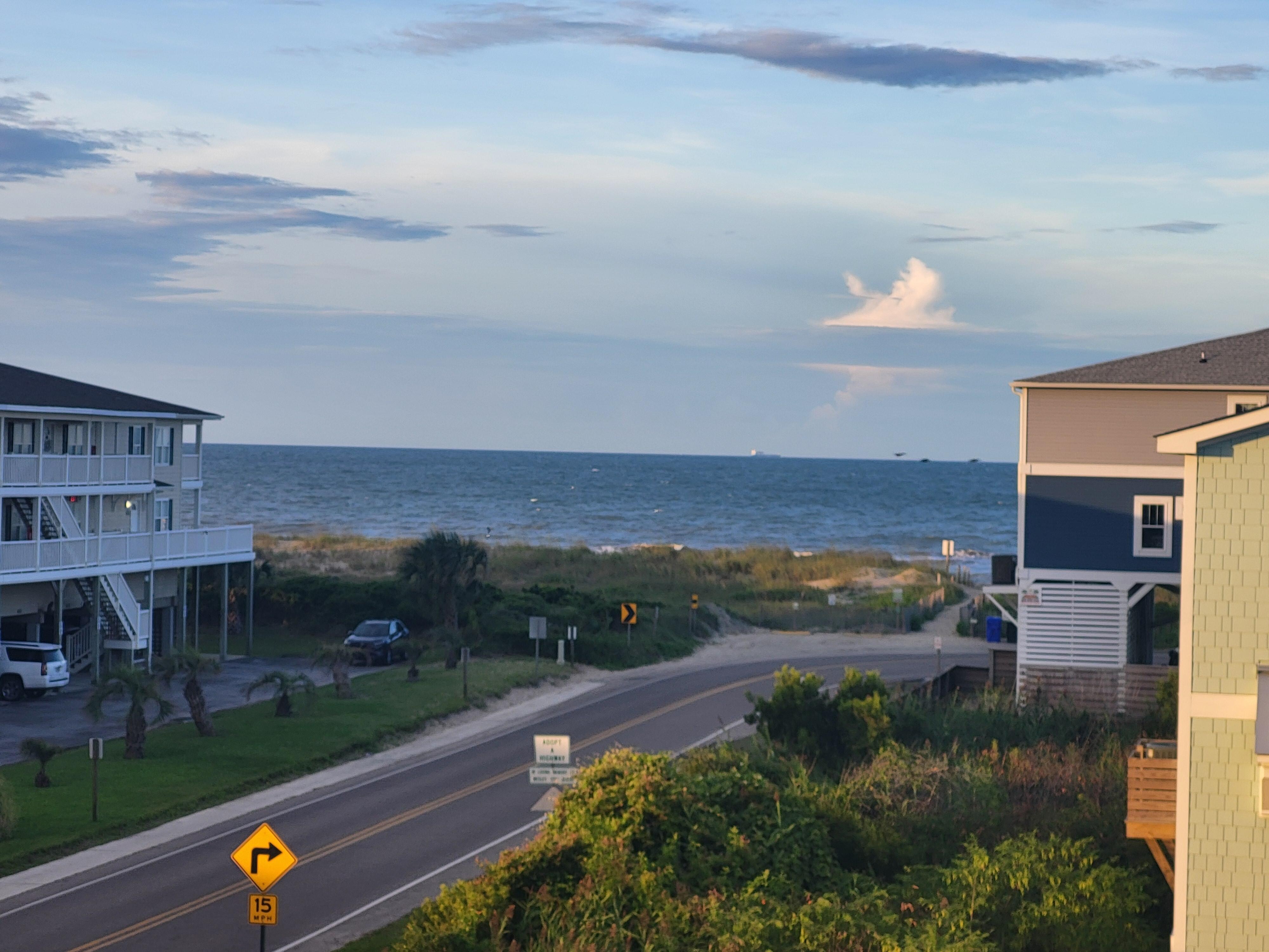View from porch shows entrance to beach