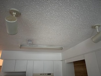 Track lights in the kitchen over the peninsula