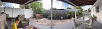 Panoramic of cute back porch where we enjoyed several meals and morning coffee