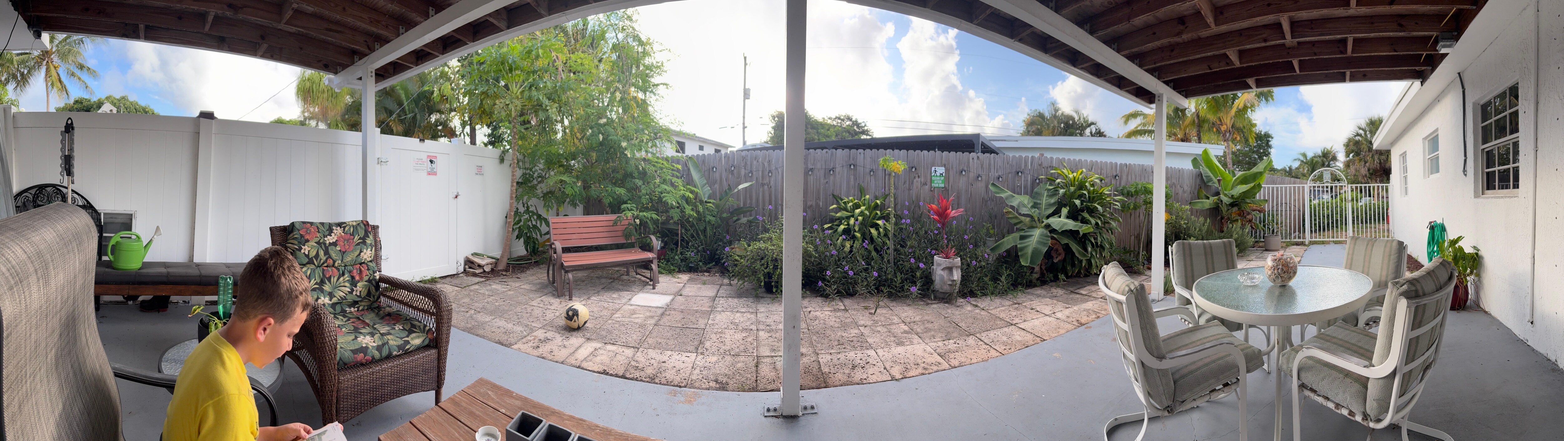 Panoramic of cute back porch where we enjoyed several meals and morning coffee