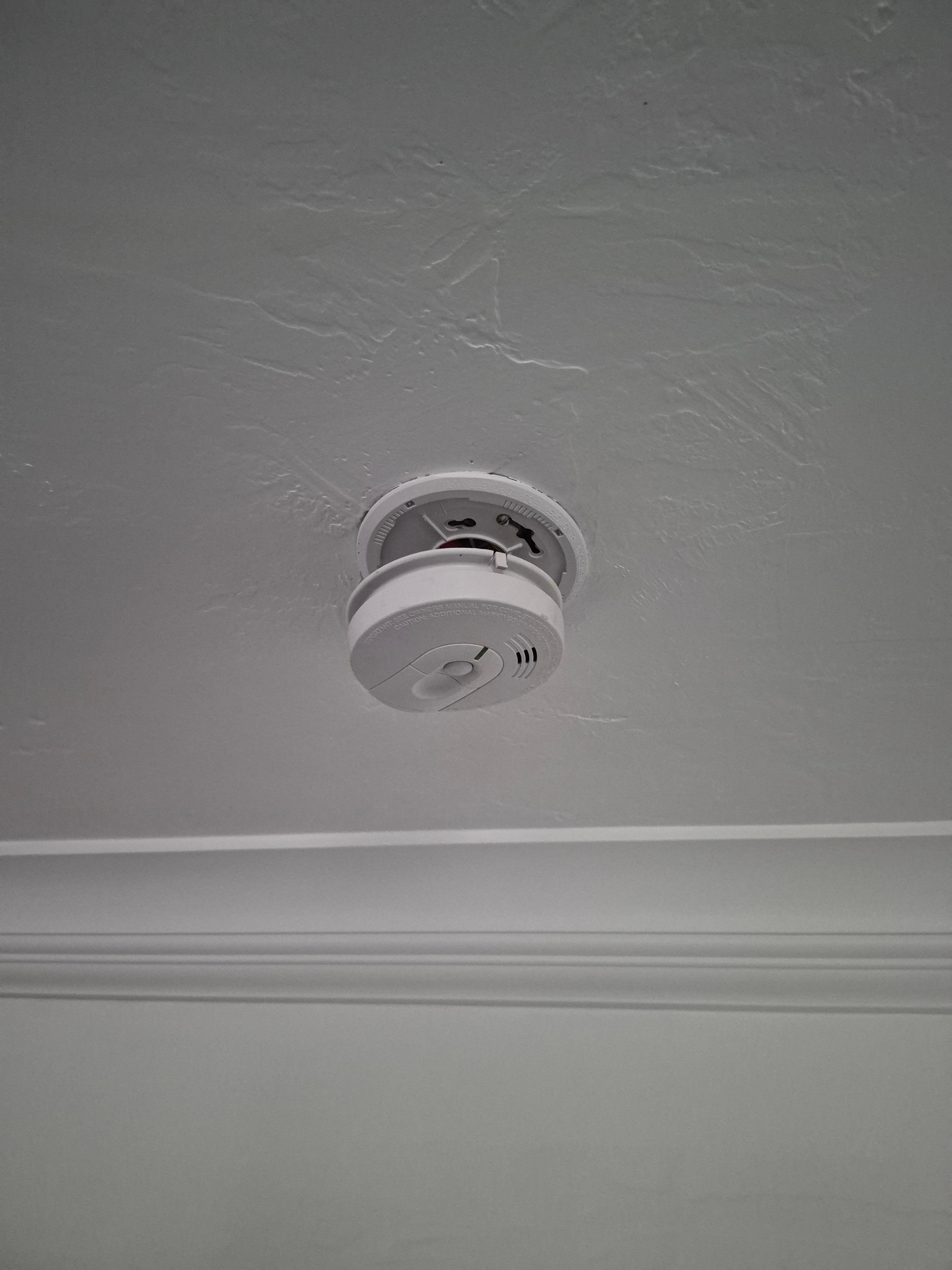 Fire or smoke alarm hanging