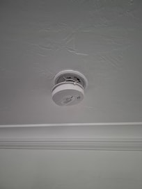 Fire or smoke alarm hanging