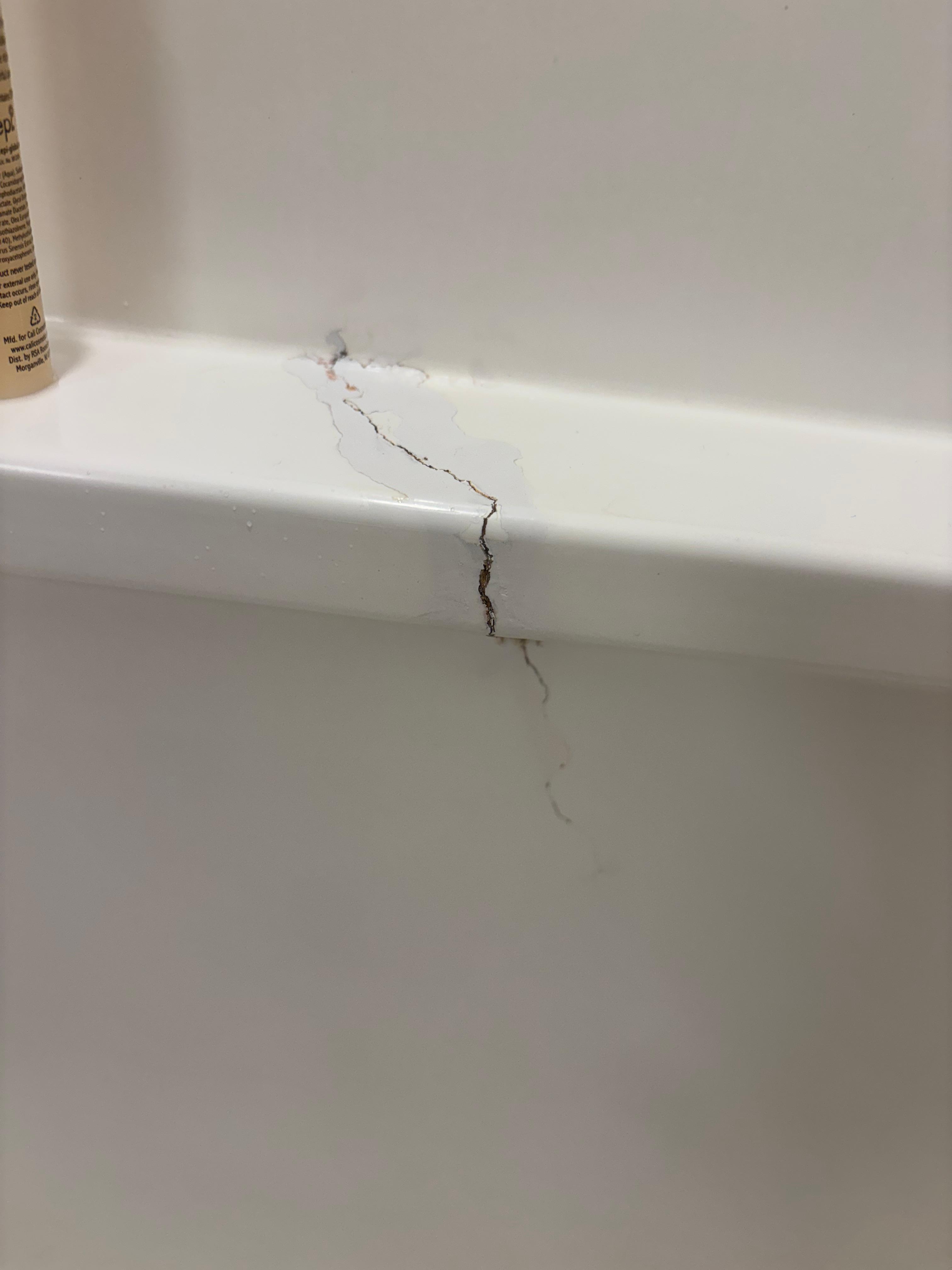 Our shower had a large crack in it.